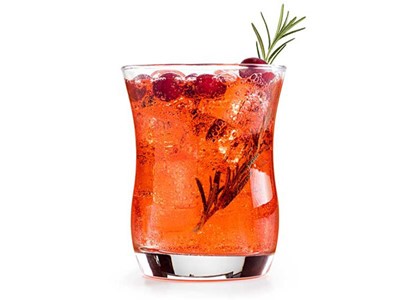 Glass of cranberry spritzer garnished with rosemary and cranberries