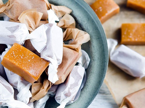 Homemade caramels wrapped in wax paper