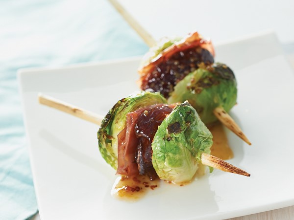 Grilled and glazed brussels sprouts on wooden skewers
