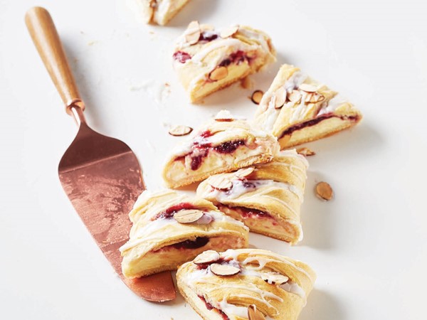 Slices of cranberry orange bread drizzled in glaze