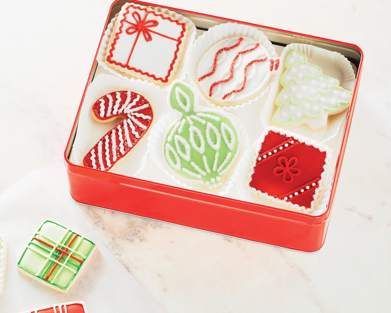 holiday gift box with decorated cookies inside
