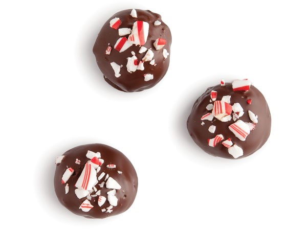 Chocolate-covered Oreo balls garnished with crushed candy cane