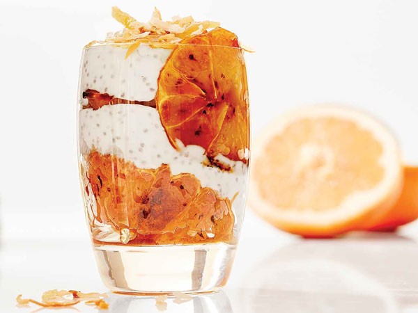 Glass filled with carmelized grapefruit parfait