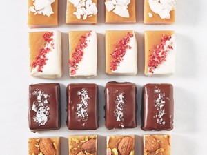 Cut caramels decorated with nuts, chocolate, and fruit