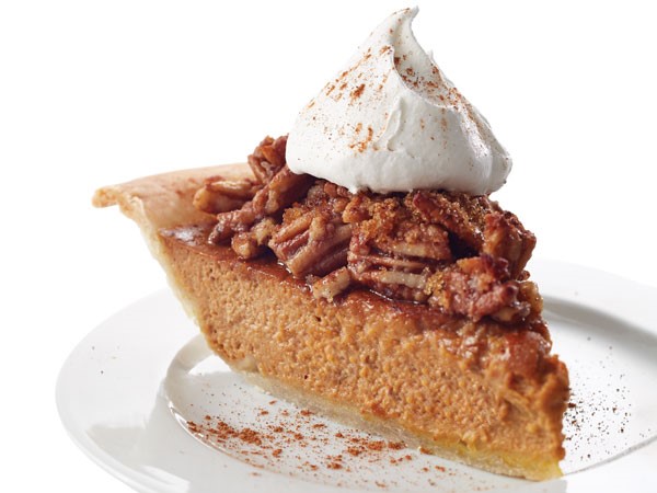Slice of pecan pie with whipped topping