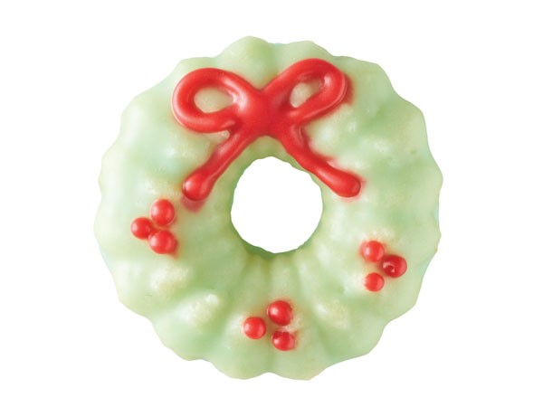 Spritz cookie decorated as holiday wreath