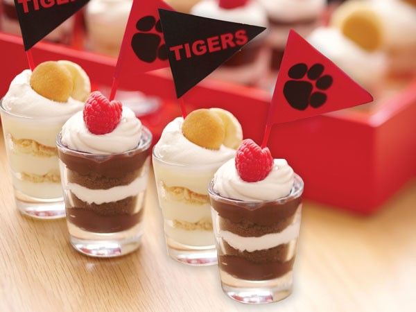 Juice glasses layered with Chocolate Pudding, Fudge Cookie, Whipped Topping and a Raspberry