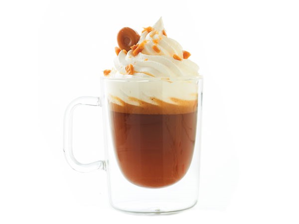 Hot buttered brandy beverage with whipped cream and toffee