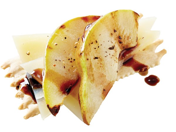 Flatbread cracker topped with Drunken Goat cheese, pear slices, balsamic and black pepper