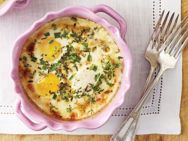 Herbed baked eggs in casserole dish