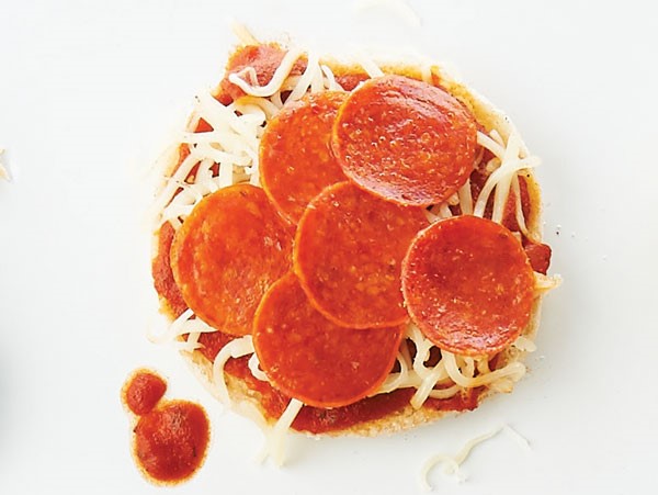 English muffin topped with pizza sauce, cheese, and pepperoni