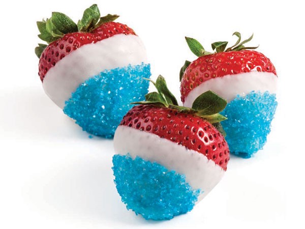 White chocolate dipped strawberries with blue coarse sugar sprinkles