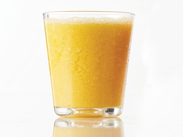 Pineapple-orange smash smoothie in glass