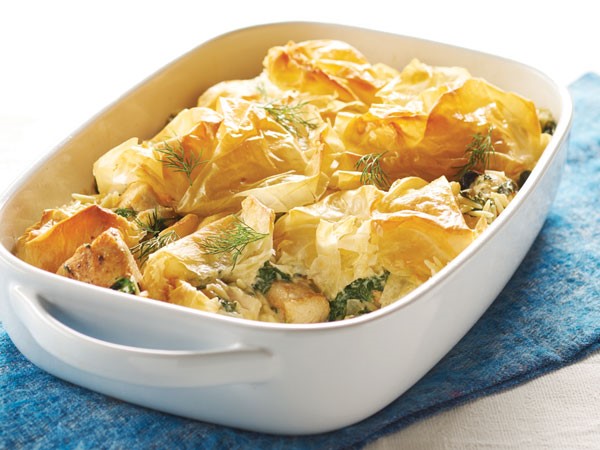 Dish filled with baked chicken spanakopita casserole