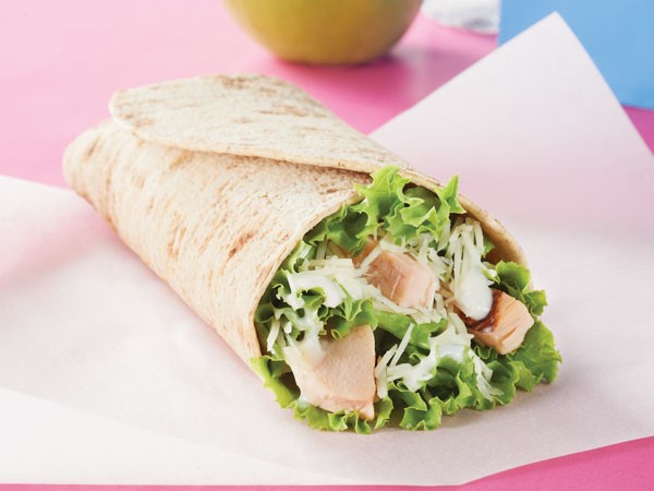 Chicken Caesar Wrap on parchment paper