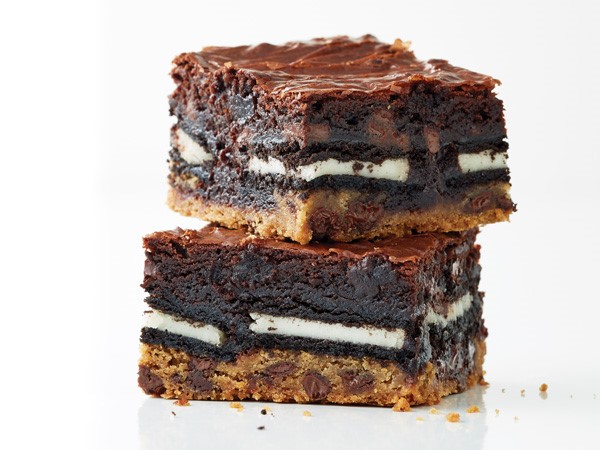 Chocolate chip cookie dough layered with cream-filled chocolate sandwich cookies and brownies