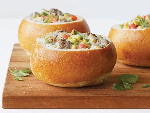 Bread bowls filled with sausage-and-potato corn chowder