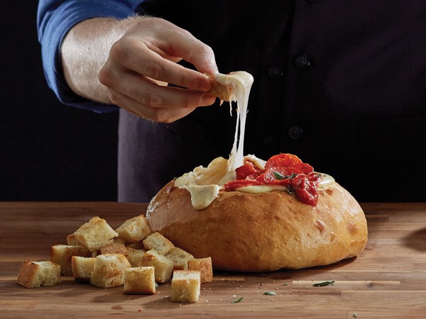 Boule bread filled with cheese and pizza sauce