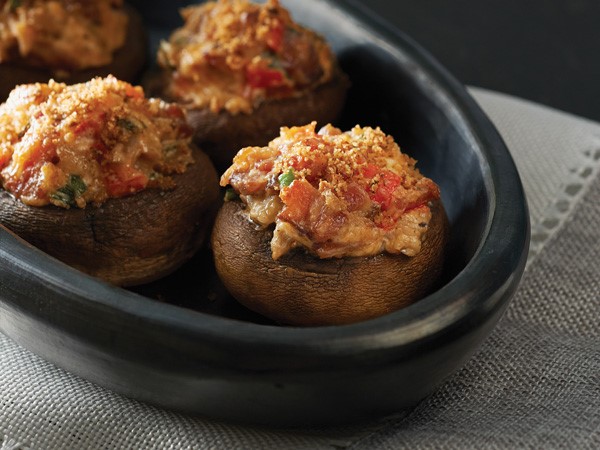 Bowl of mushrooms stuffed with bacon and cheese