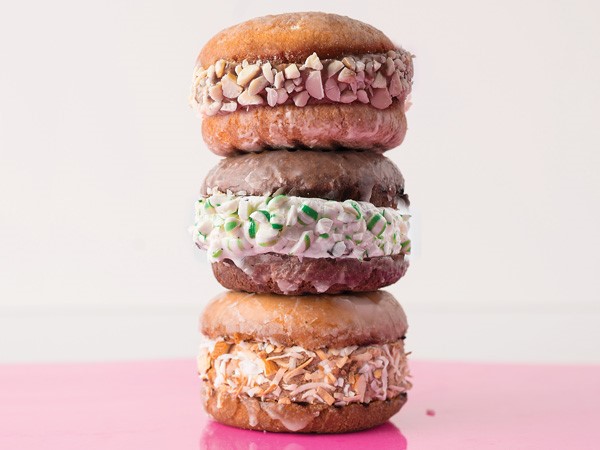 Glazed donut sandwiches filled with ice cream and dipped in candy