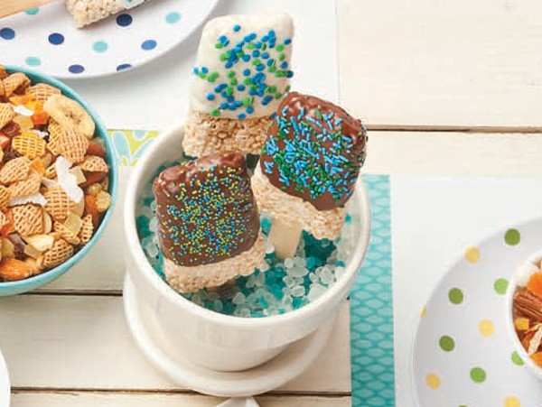 Chocolate-dipped crispy rice pops in white and milk chocolate with blue and green sprinkles