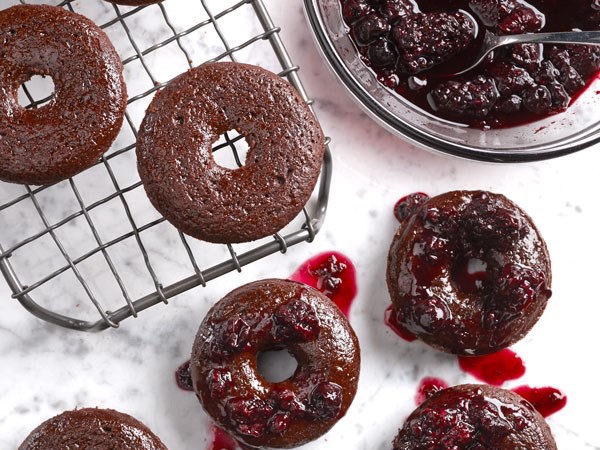 Chocolate red wine donuts on marble background topped with red wine glaze