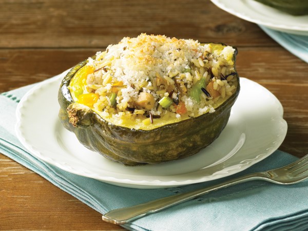 Plate of acorn squash filled with chicken and wild rice