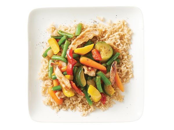 Rice topped with stir fried veggies and pork