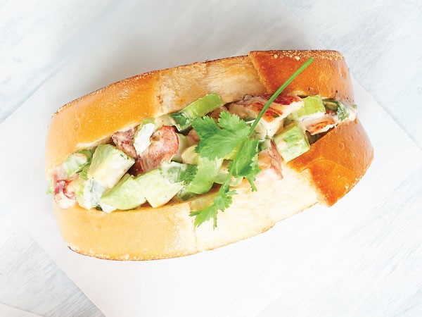 White plate of avocado lobster rolls