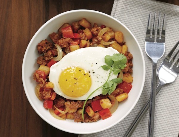chorizo hash in bowl with an egg on top