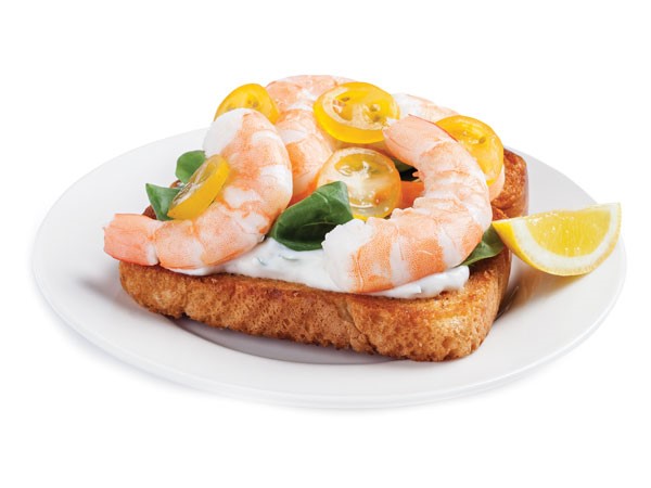 Ciabatta sandwich topped with Greek yogurt, spinach, yellow cherry tomatoes and shrimp