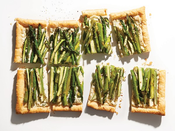 Rectangles of three-cheese tart topped with asparagus