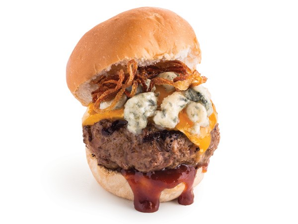 Cheeseburger patty with barbecue sauce, bleu cheese and caramelized onions between a slider bun