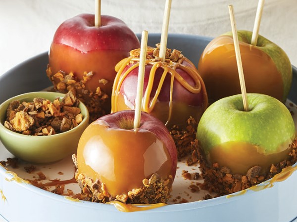 Caramel apples dipped in crushed Butterfingers