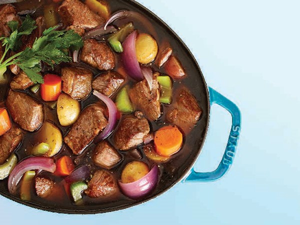 Beef and vegetable soup in a Dutch oven