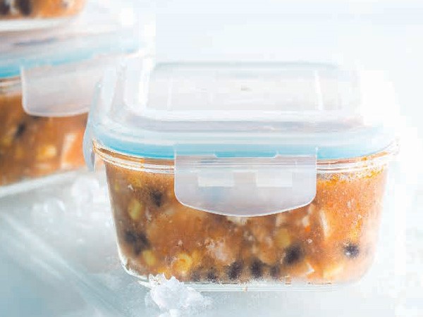 Plastic container filled with chicken enchilada starter