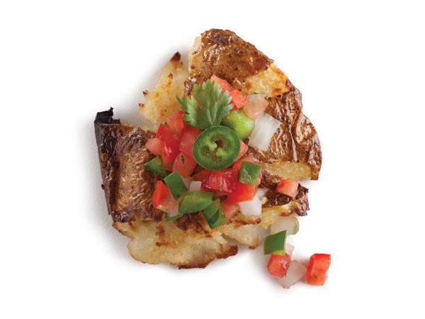 Smashed potatoes topped with pico de gallo