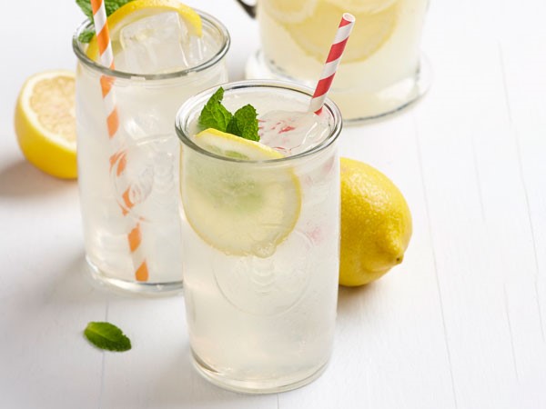 Lemonade in glassed garnished with mint, lemon slices, and fresh mint