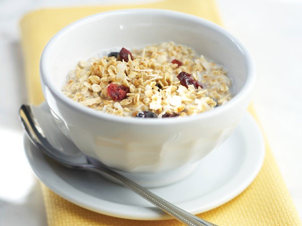 Bowl of berry granola with a spoon