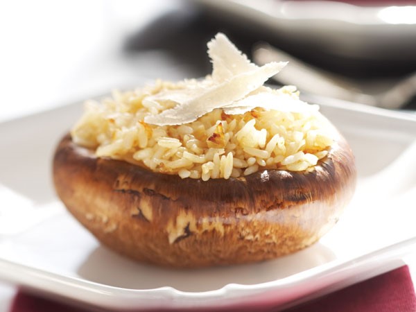 Portobello mushroom stuffed with rice and topped with cheese
