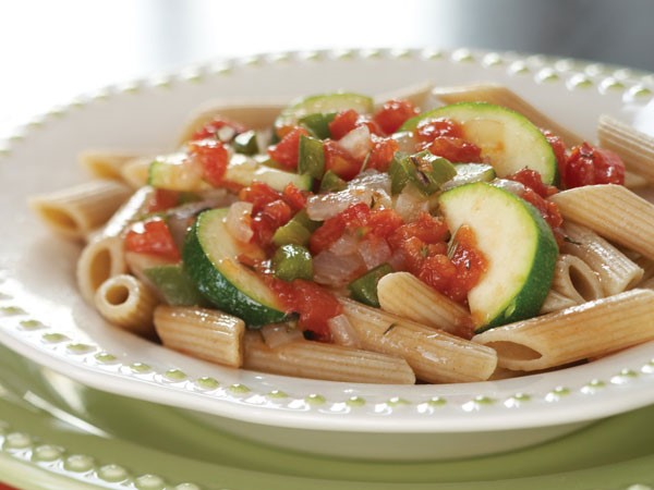 Whole wheat pasta topped with sauteed vegetables