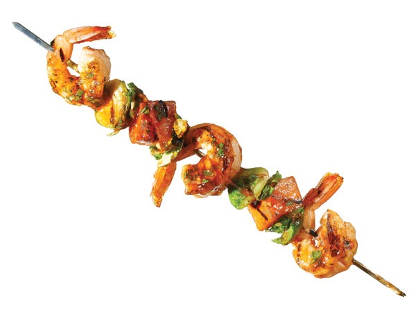 Grilled shrimp, brussels sprouts, and sweet potatoes on metal skewer