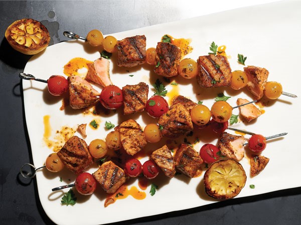 Grilled salmon kabobs with tomatoes on skewers