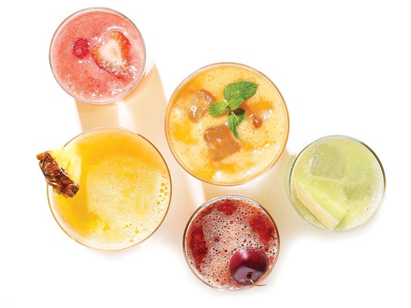 Glasses of fresca garnished with fresh fruit