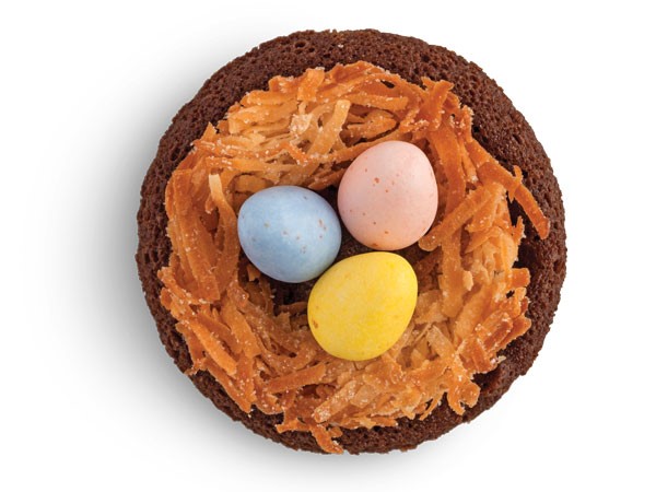 Circle fudge brownie topped with coconut nest and Easter egg candies