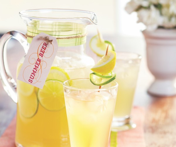 Summer beer in pitcher with glasses