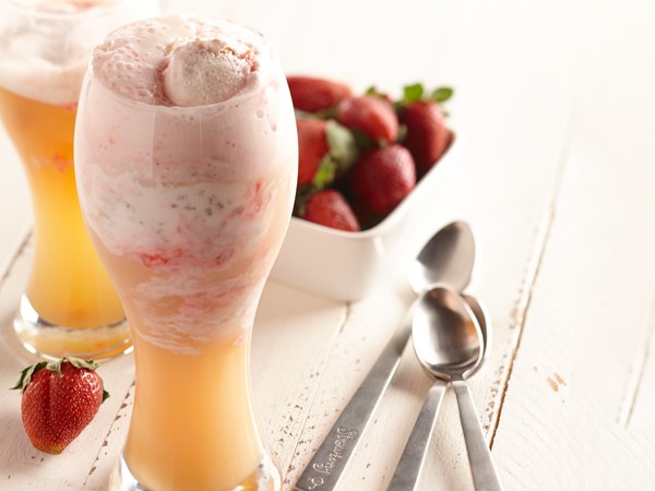 Beer in hefeweizen glass with strawberry ice cream