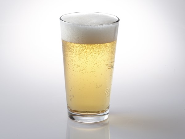 American lager in glass with foam
