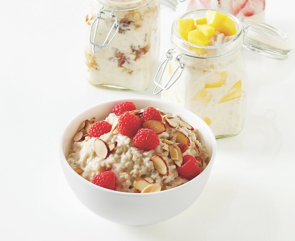 overnight oatmeal in a bowl with jars in background