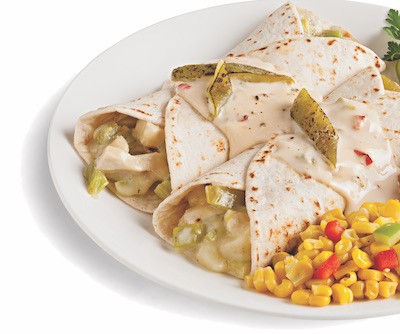 Two enchiladas filled with chicken and hatch chiles served with a side of corn on a white plate